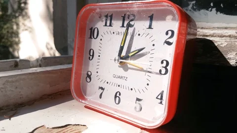 Table clock on windowsill of old summer house Video stock 95485468
