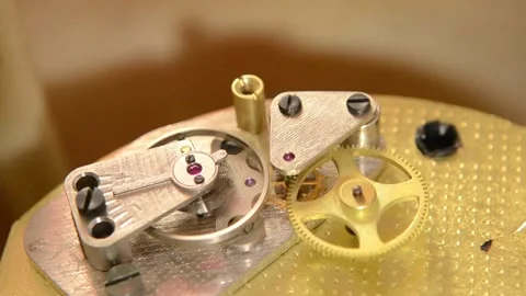 Table clock,yellow clock mechanism,gears. Stock Footage 140333239