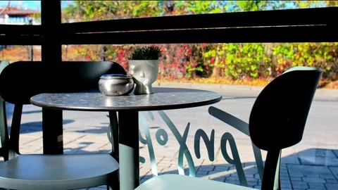 TABLE AT A COFFE SHOP WITH TWO CHAIRS Video stock 314459436
