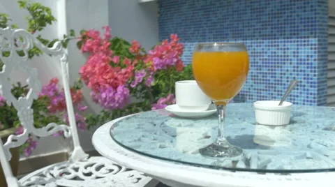 Table with coffee and orange juice, outdoor terrace. Stock Footage 51197044
