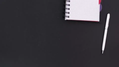 Table with coffee cup, note book and pen 動画素材 184469301