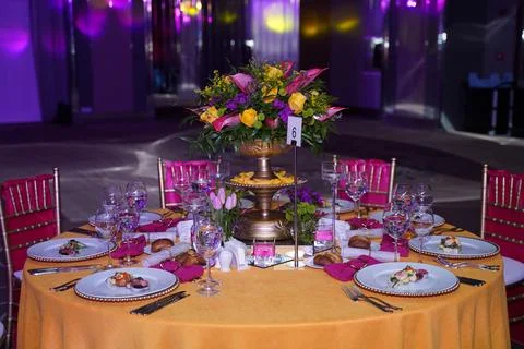 Table with colored flower decoration Stock Photos