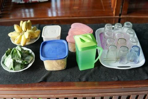 A table containing snacks, in the form of ripe bananas, banana chips and tr.. Stock Photos