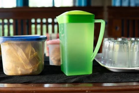 A table containing snacks, in the form of ripe bananas, banana chips and tr.. Stock Photos