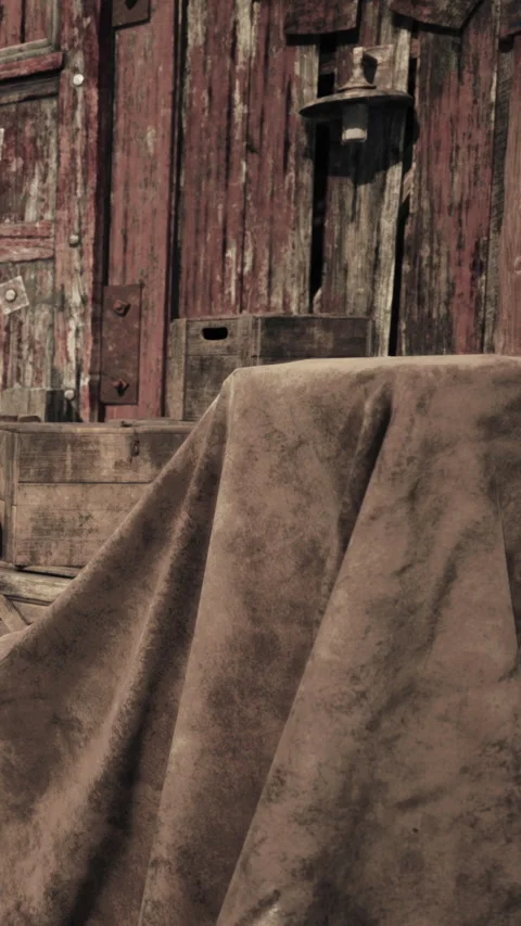 Table covered with cloth near old wooden wall and crates in outdoor space Stock Footage 339389865