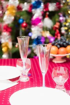 Table covered tablecloth background dressed up Christmas tree Fotos de archivo