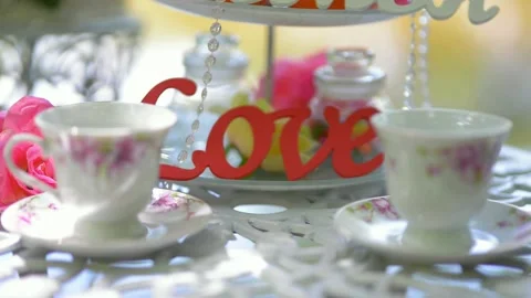 Table with crockery cups plates decorative love wedding entourage Stock Footage 222297132