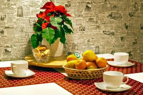 Table with cups and fruit. Stock Photos
