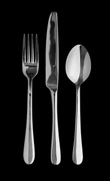 Table cutlery black background Stock Photos