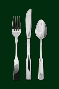 Table cutlery green background Stock Photos
