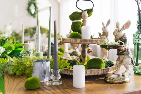 Table decor for spring concept. Easter, candles bunny, vintage Stock Photos