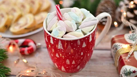 Table decorated for New year with Christmas hot drink with marshmallow Stock Footage 221936680