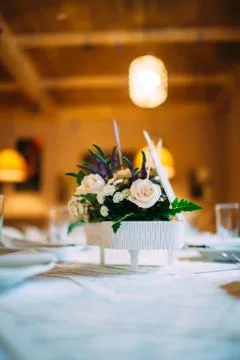 Table decorated with notes and flowers in a small piano. Stock Photos