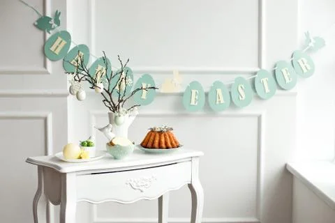 Table decoration with champagne for a festive easter dinner Stock Photos