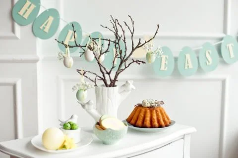Table decoration with champagne for a festive easter dinner Stock Photos