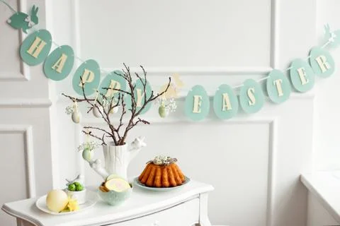Table decoration with champagne for a festive easter dinner Stock Photos