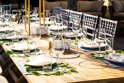 Table decoration before the festive feast. Decorating before the holiday. Stock Photos