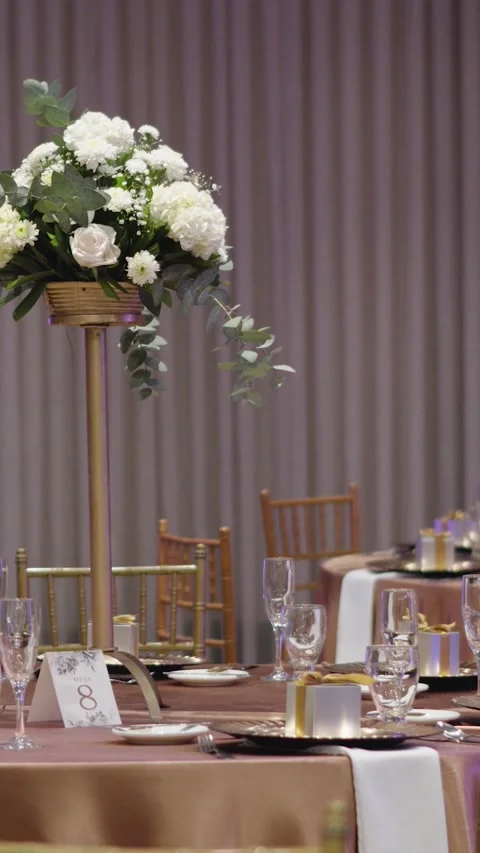 Table decoration for a wedding celebration. Tall centerpiece with white flowers Stock Footage 270082103
