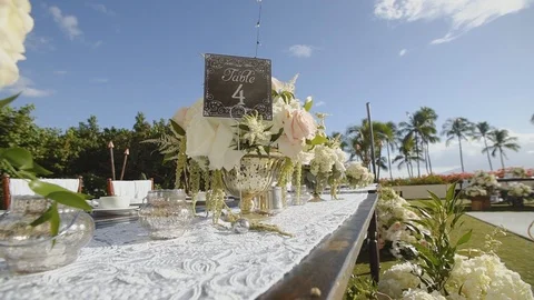 Table decorations at a wedding with beautiful flowers on resort hyatt,maui Stock Footage 101116270