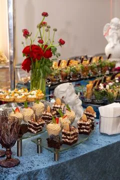 Table with different desserts catering at the event Stock Photos