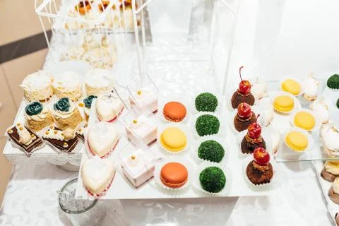 Table with different sweets for party. Candy bar. Stock Photos