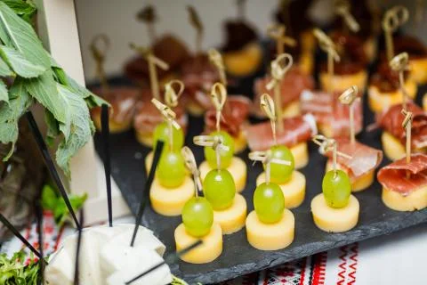 Table with different type of snacks preparing for party. Stock Photos