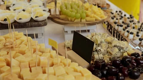 Table with different types of cheese. Cheese tasting. Table with hard cheeses Stock Footage 253322085