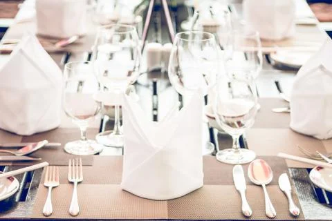 Table dining set in the hotel restaurant - light vintage filter effect proces Stock Photos