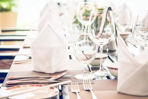 Table dining set in the hotel restaurant - light vintage filter effect proces Stock Photos