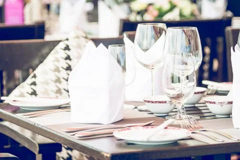 Table dining set in the hotel restaurant - light vintage filter effect proces Stock Photos
