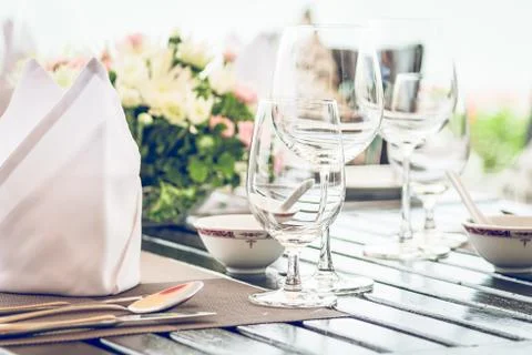 Table dining set in the hotel restaurant - light vintage filter effect proces Stock Photos