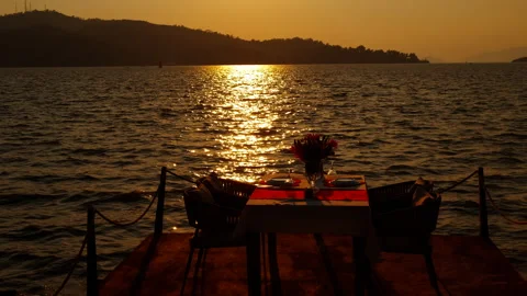 Table with dishes against evening. Stock Footage 293251572