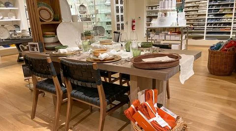 A table display with dishes, silverware and glasses at a Williams Sonoma stor Stock Photos