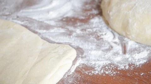 On the table, the dough is smoothed Stock Footage 94348199