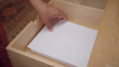 Table drawer contains blank sheets of paper for notes Stock Footage 338153000