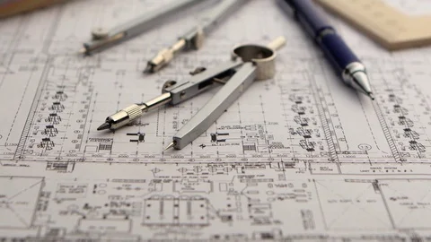 On the table is a drawing for builders and stationery. Close up Stock Footage 73672405
