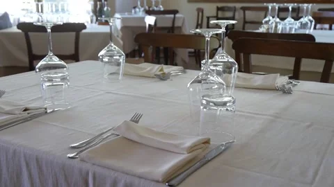 A Table in an Empty Restaurant With Glasses and Utensils for Four People Video stock 244815355