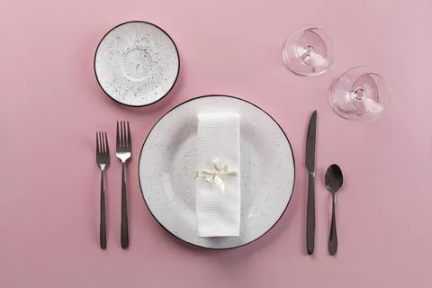 Table etiquette with pink background top view Stock Photos