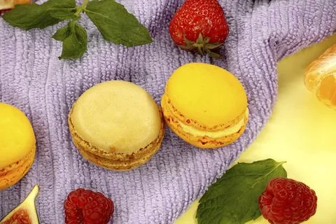 Table filled with array of macaroons and fruits visual appeal of the food, Foto stock