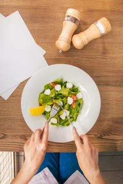 At the table from the first person Stock Photos