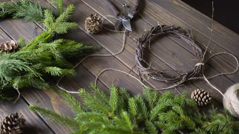 Table with florist tools and xmas wreath Stock-Footage 162779291