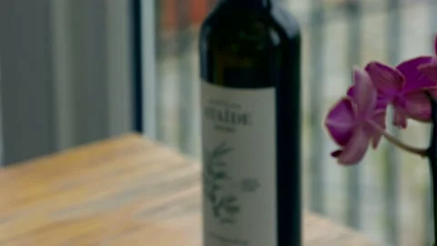 Table with Flower, Olive Oil and Bread Stock Footage 166170669
