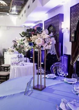 Table with flowers decoration Stock Photos