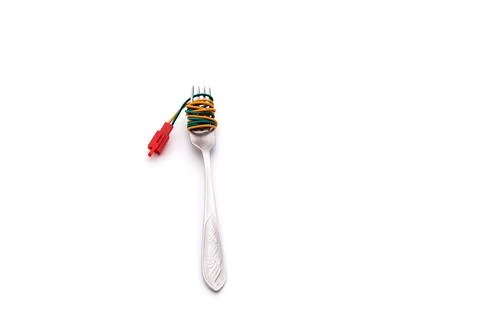 Table fork and spaghetti wires Stock Photos