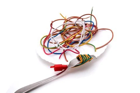 Table fork and spaghetti wires Stock Photos