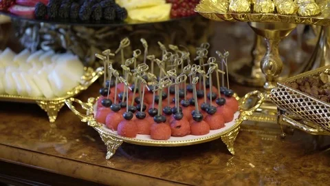 Table with fruits decorated with flowers Stock Footage 80876068