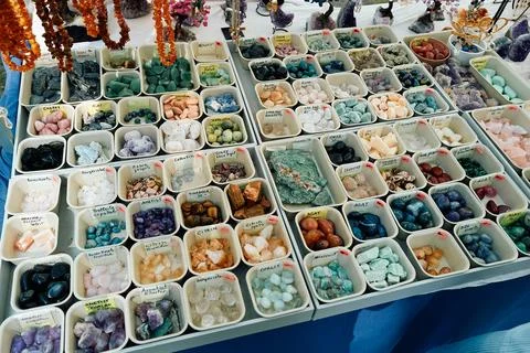 A table full of different colored stones and crystals Stock Photos