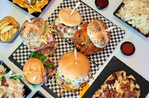 A table full of different types of sandwiches and other food items Stock Photos