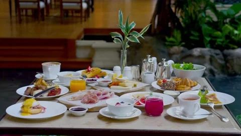 Table full of various fresh food in luxury modern restaurant in hotel Видео 230369443
