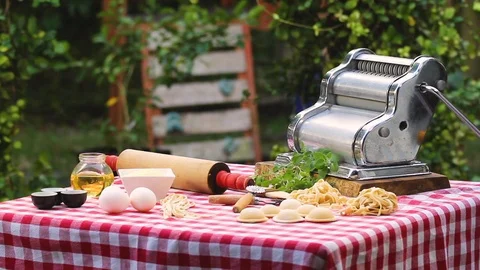 Table in a garden with different kind of ingredients and utensils to prepare Ita Stock Footage 91046019